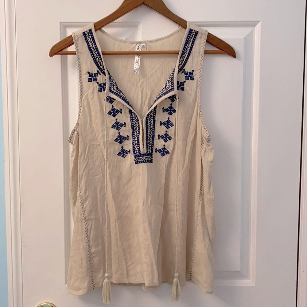 Cream/tan tank with blue accents.